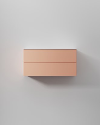 Servantskap i aprikosgul nyanse – en av de trendy baderomsfargene i 2026.